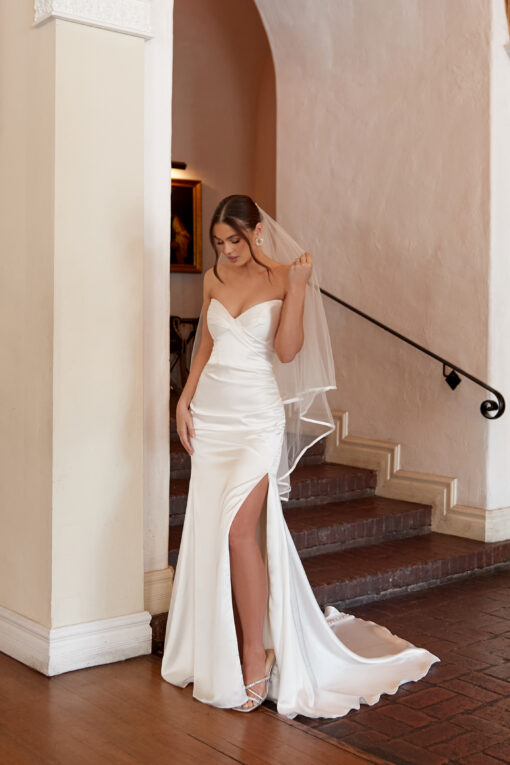 Essense of Australia D4034 strapless charmeuse wedding gown with sweetheart neckline, fitted column silhouette, optional slit, and fabric‑covered button back
