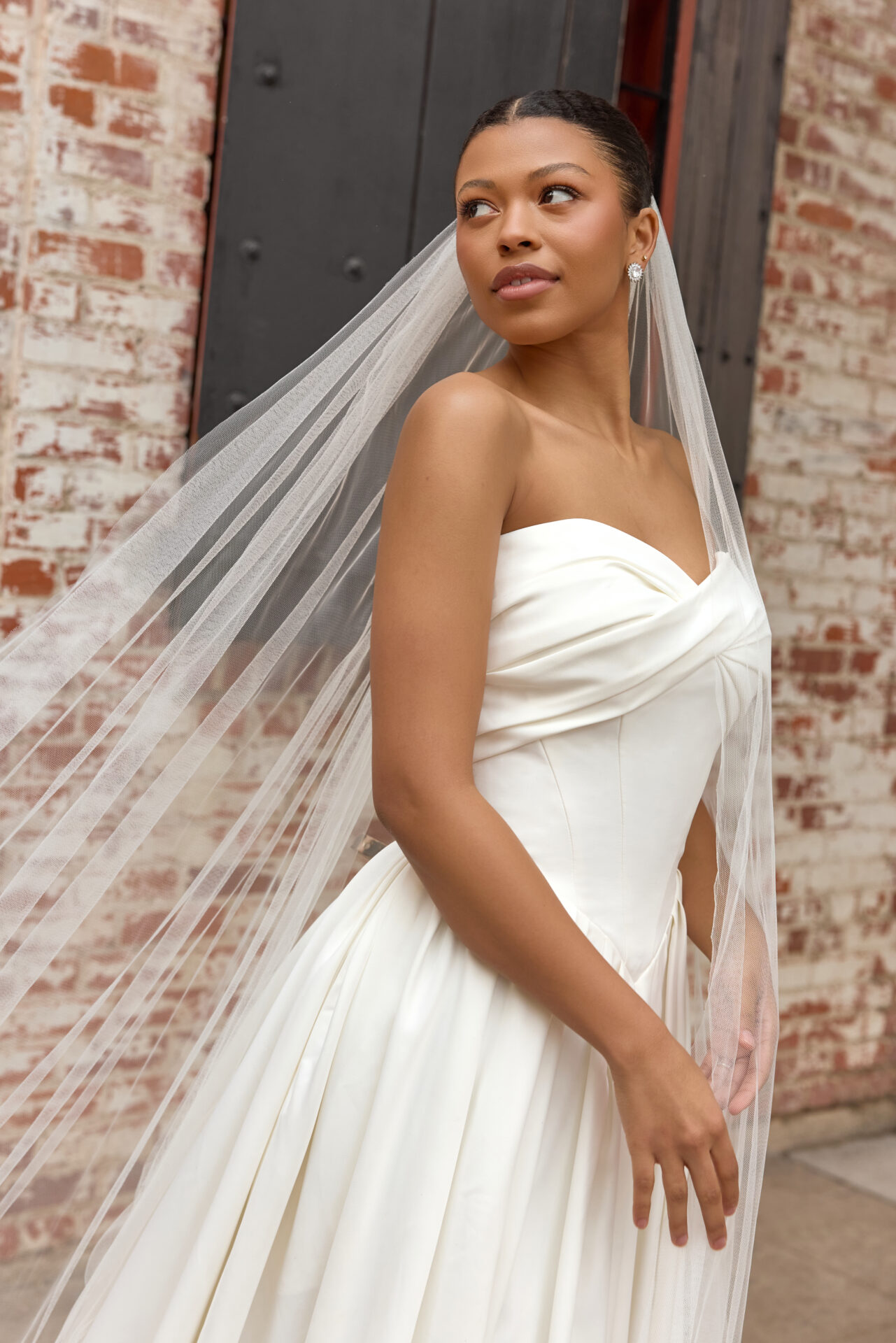 Essense of Australia wedding dress Style D4269 featuring a strapless draped bodice and flowing matte satin A-line skirt