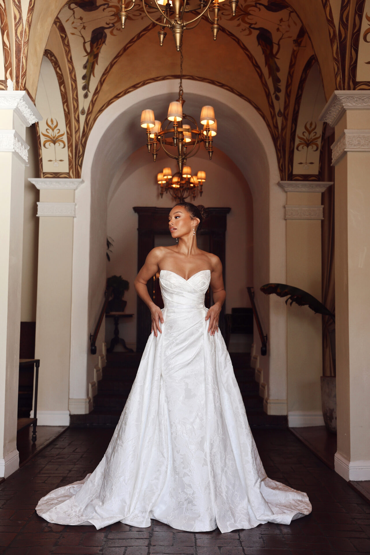 Essense of Australia wedding dress Style D4300 featuring a strapless ruched bodice, column silhouette, and detachable overskirt