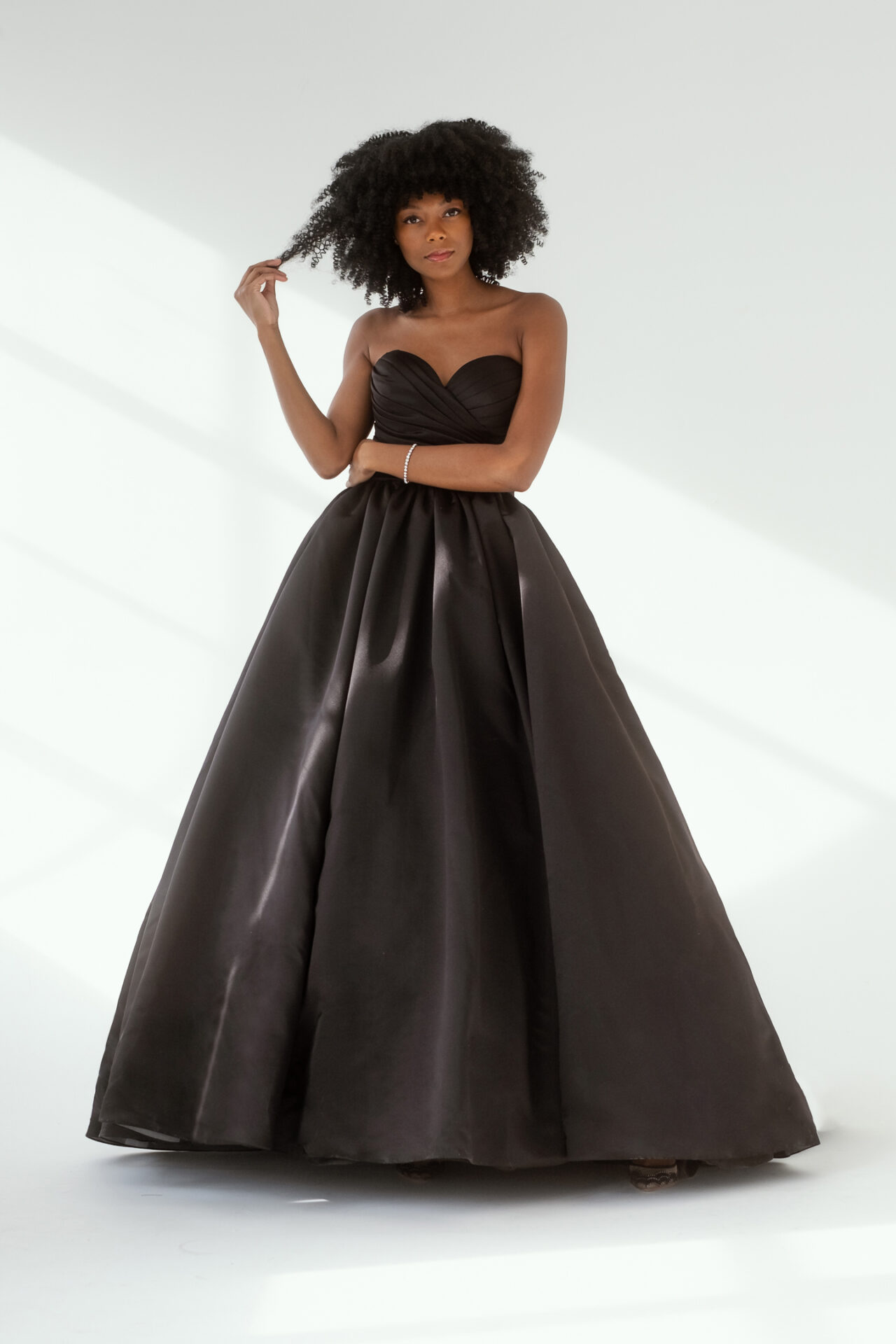 Model wearing a black wedding dress from the Bliss Noir Collection at Bliss Bridal Salon in Fort Worth.