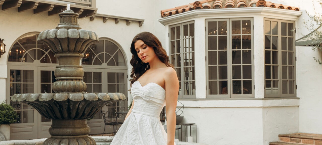 Stella York wedding dress SY8059 featuring a strapless ruched bodice and satin jacquard A-line ballgown skirt