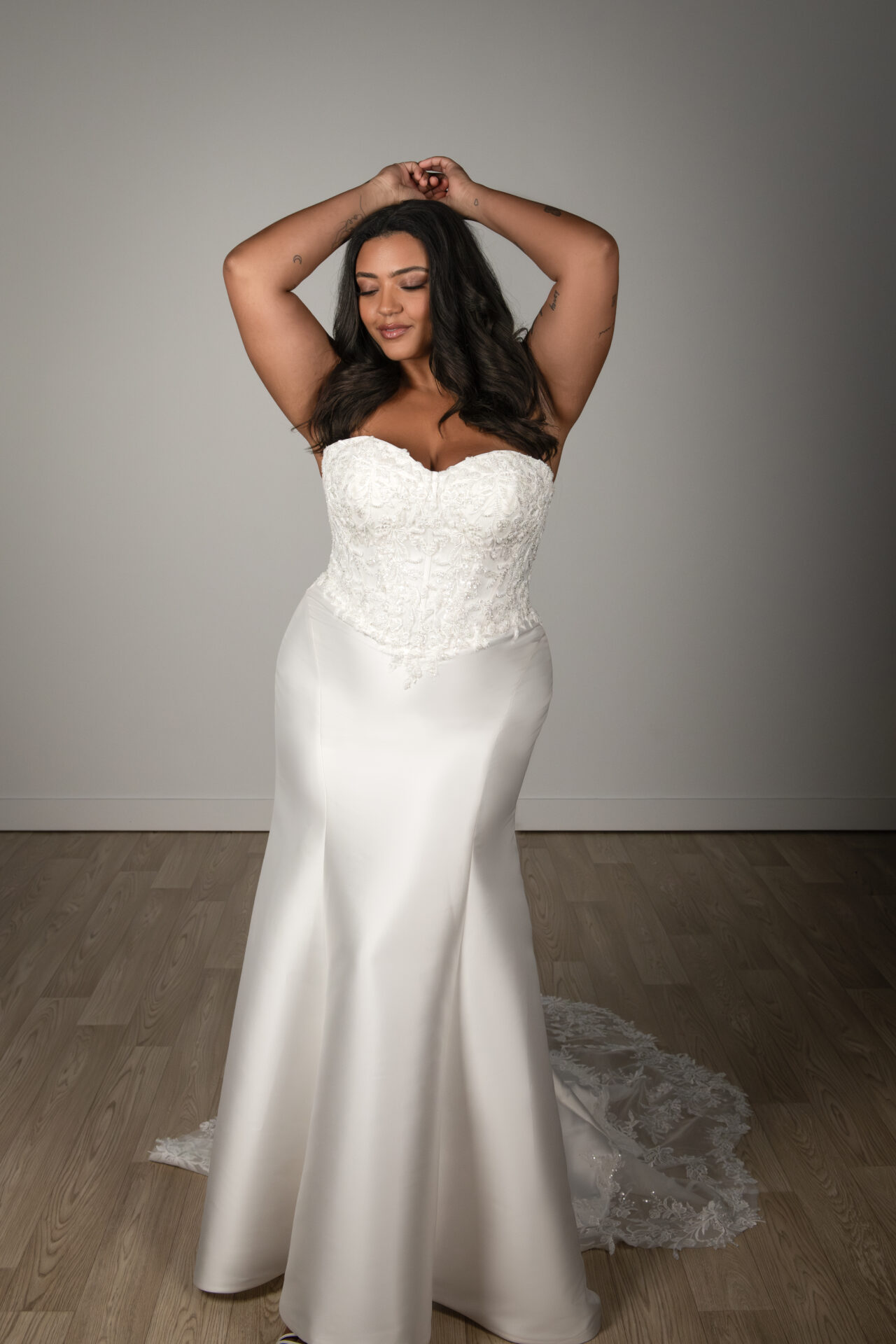 Stella York wedding dress SY8163 with strapless corset bodice, lace appliqués, and dramatic Mikado fit-and-flare silhouette